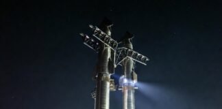 What Are the Most Ambitious Space Missions in 2025 floodlights while a regular guy in hoodie and pajama pants stands